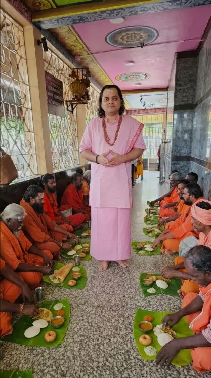 Acharya Vasudev Ji blessing devotees during a spiritual gathering